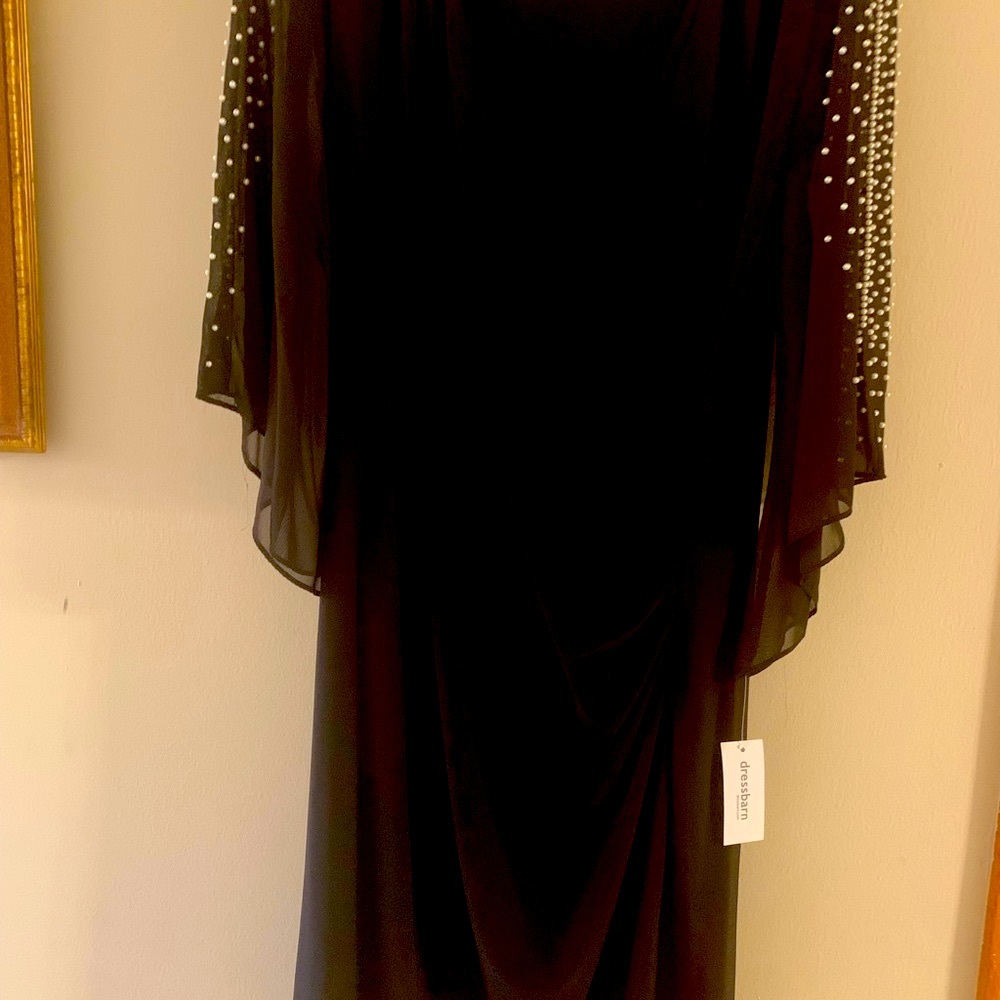 Woman’s black Dress with sheer bell sleeves with pearl accents
